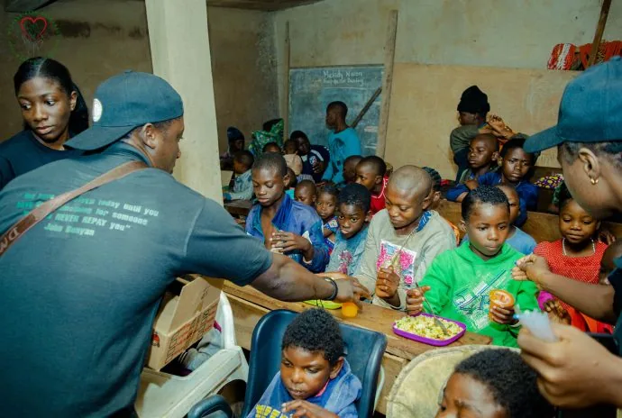Young women and men gather for a community activity.
